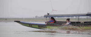 Speeding along in a long boat on Lake Semayang. Vera Korasidis and Matilda O'Connor (both from Melbourne University, Australia) enjoy the breeze.