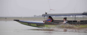 Speeding along in a long boat on Lake Semayang.  Vera Korasidis and Matilda O'Connor (both from Melbourne University, Australia) enjoy the breeze. 